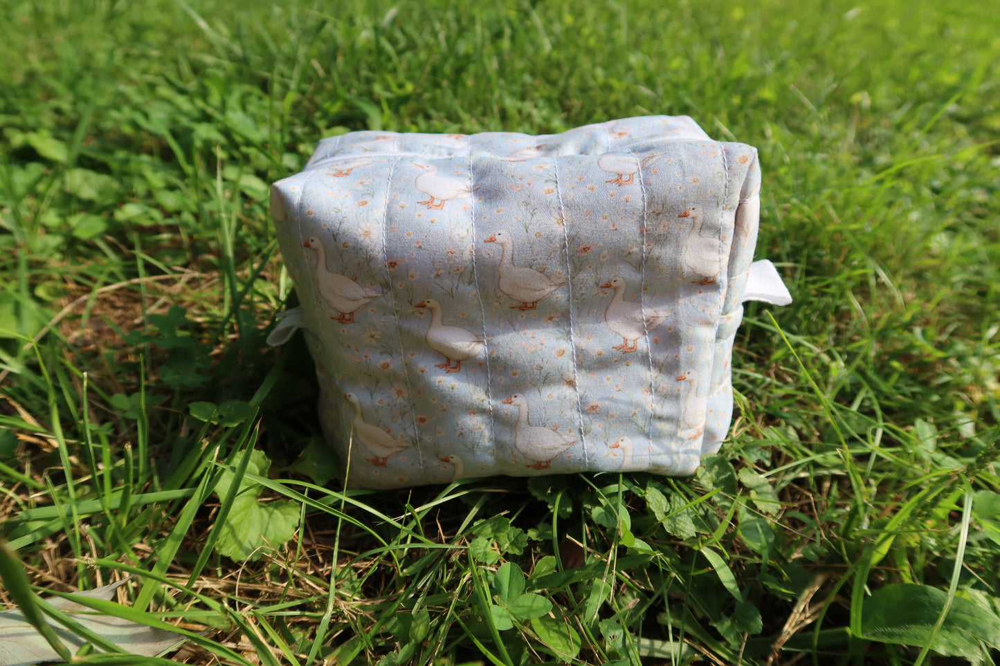 walking in daisies geese makeup bag